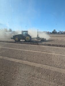 Mark Freeman Alfalfa Planting A tractor and laser leveling to prepare for planting alfalfa